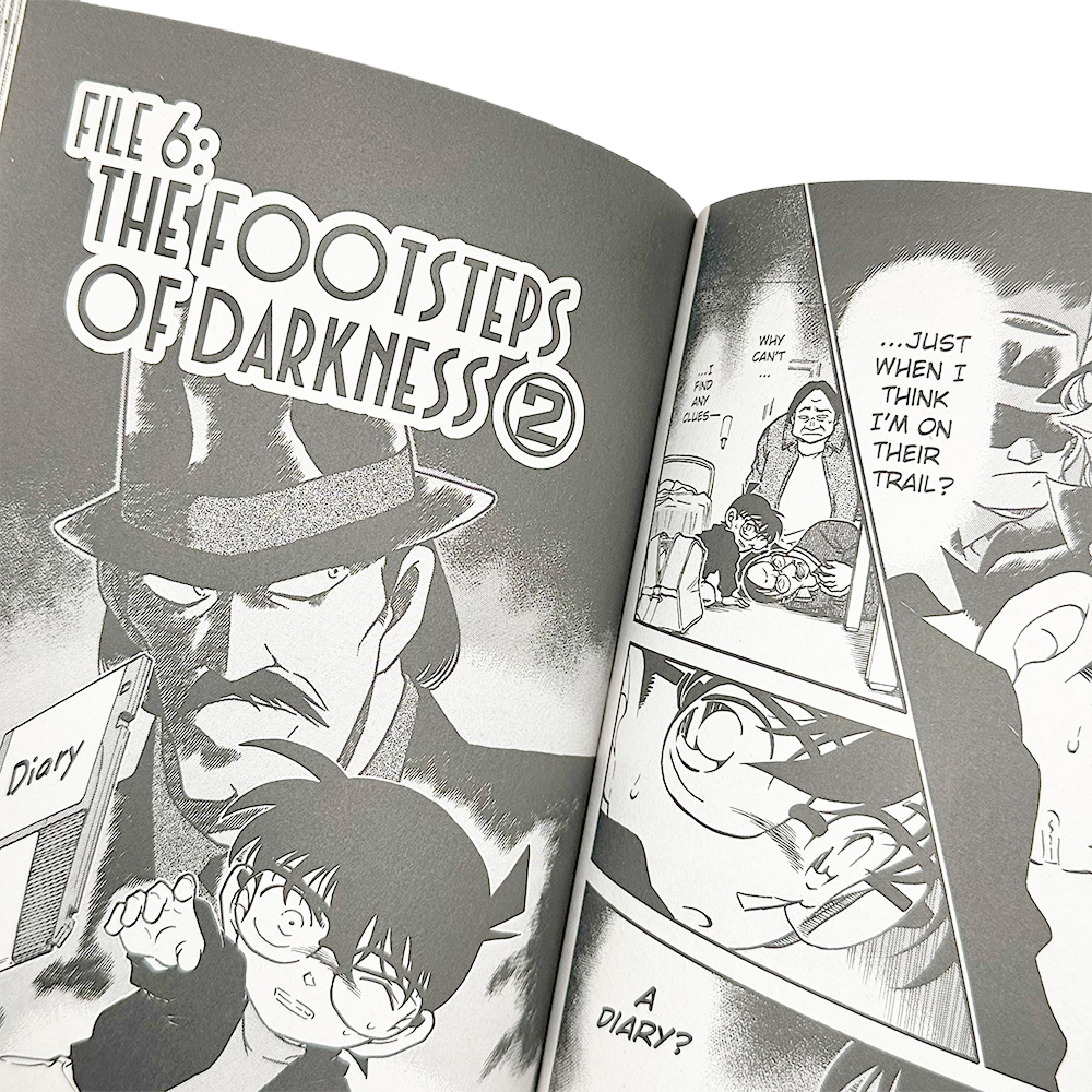 Detective Conan Osa 37 anime manga - sisäsivu, jossa hahmot tutkivat päiväkirjan johtolankoja.
