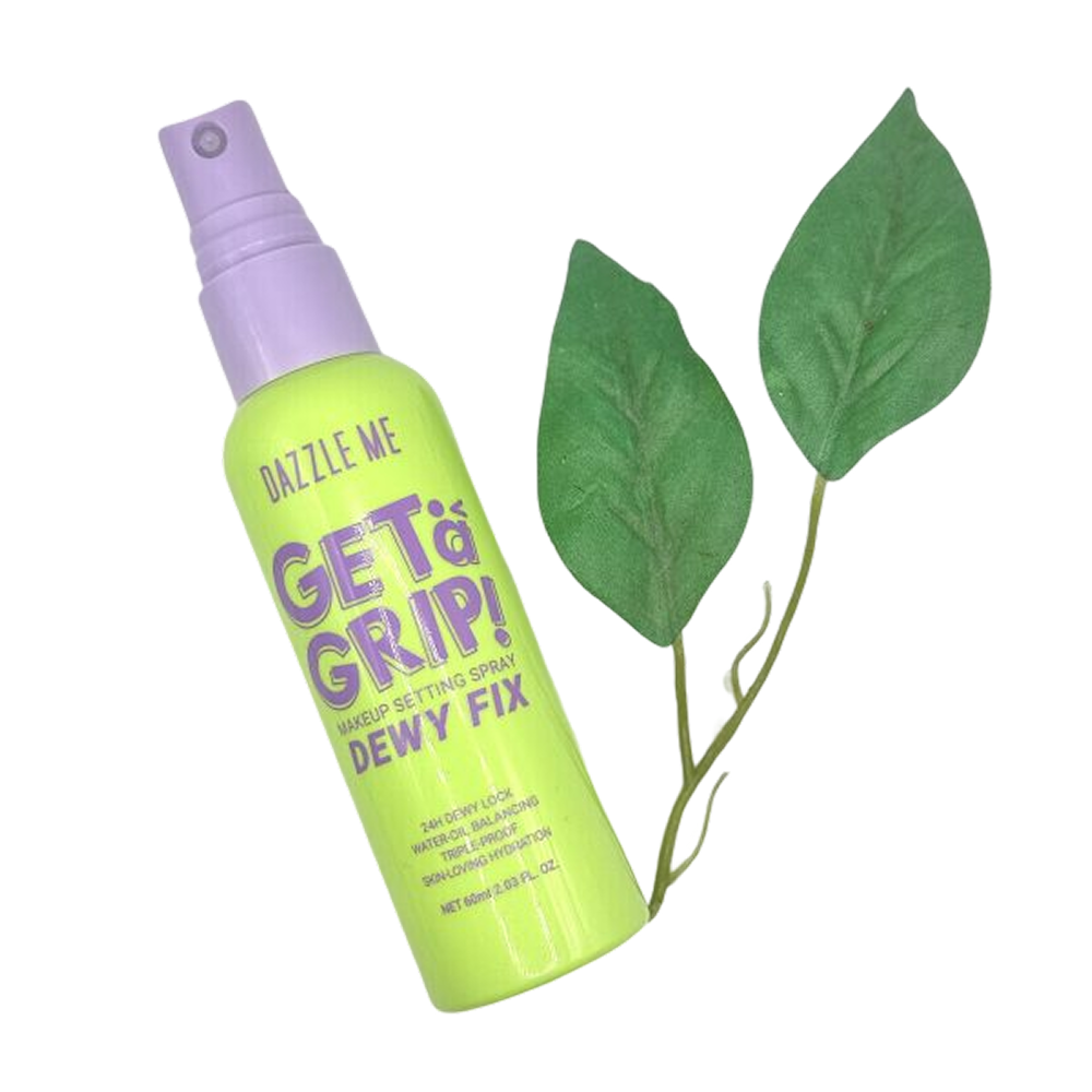 Dazzle Me Get a Grip! fixer spray -meikin kiinnityssuihke vihreiden lehtien kanssa tuotesivulla.