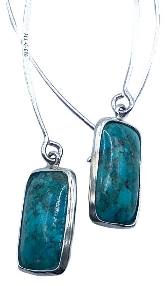 Silver drop earrings featuring rectangular turquoise stones in bezel settings.