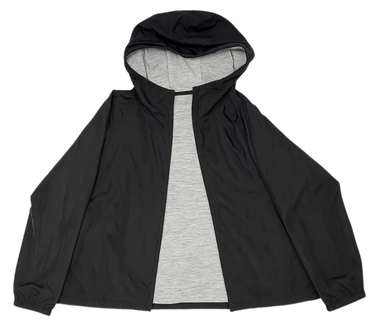 Uniqlo Reversible Parka shown in black with a hood and light gray inner lining, displayed flat.