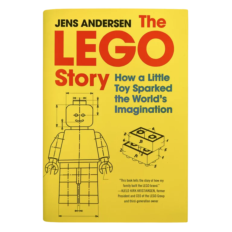 Okładka książki "The LEGO Story" z żółtym tłem i schematem ludzika LEGO.